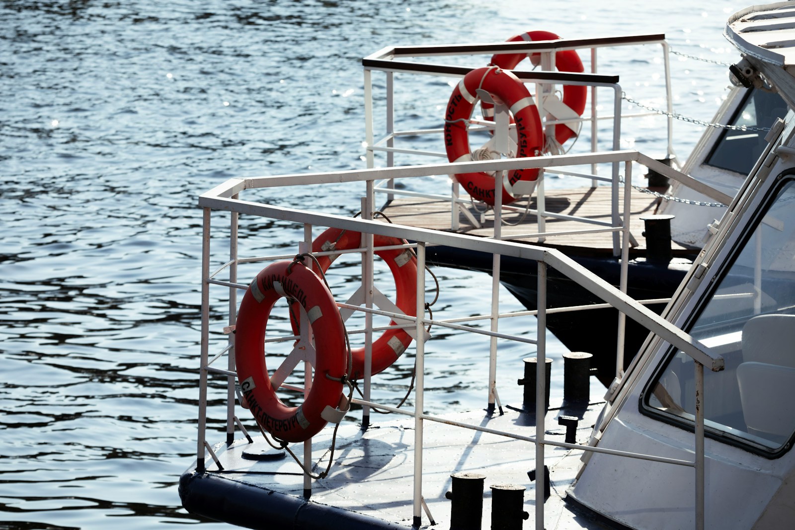 Two life preservers on a boat deck
